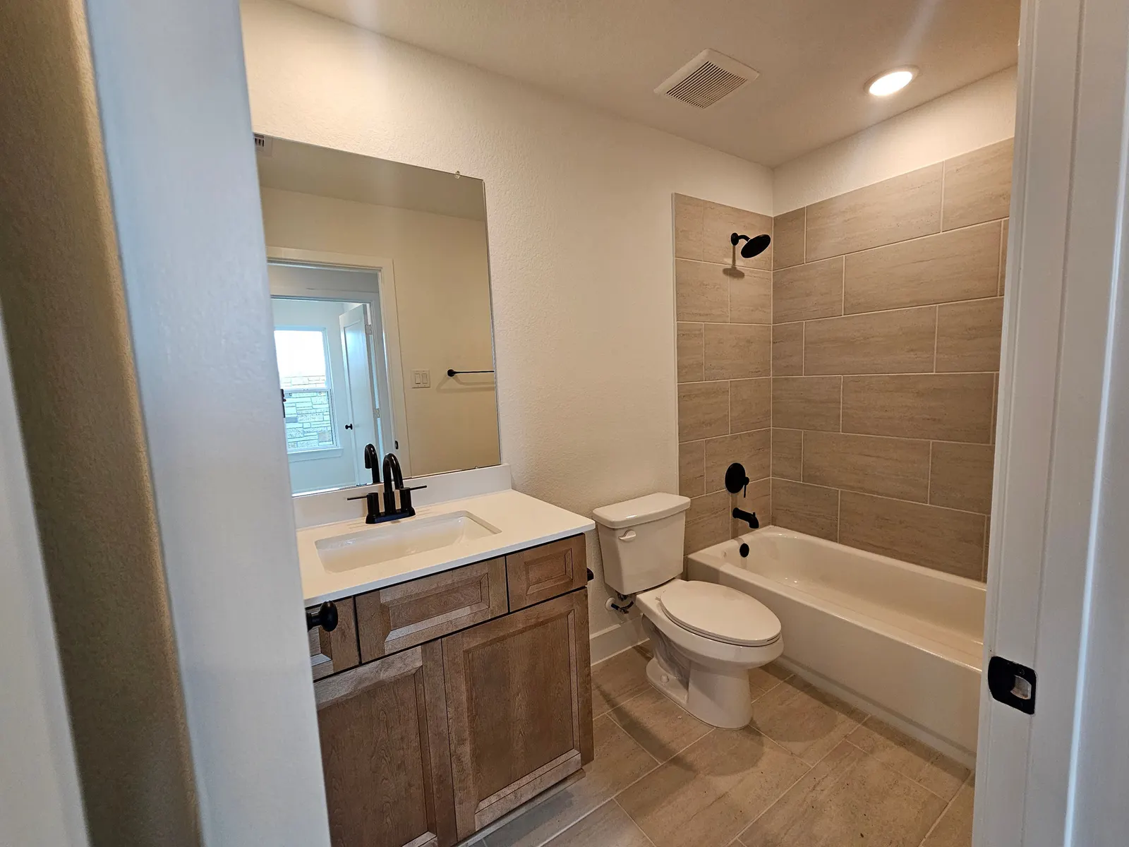 Secondary bathroom with tub and shower at 10727 Crockett Meadows, Conroe, TX