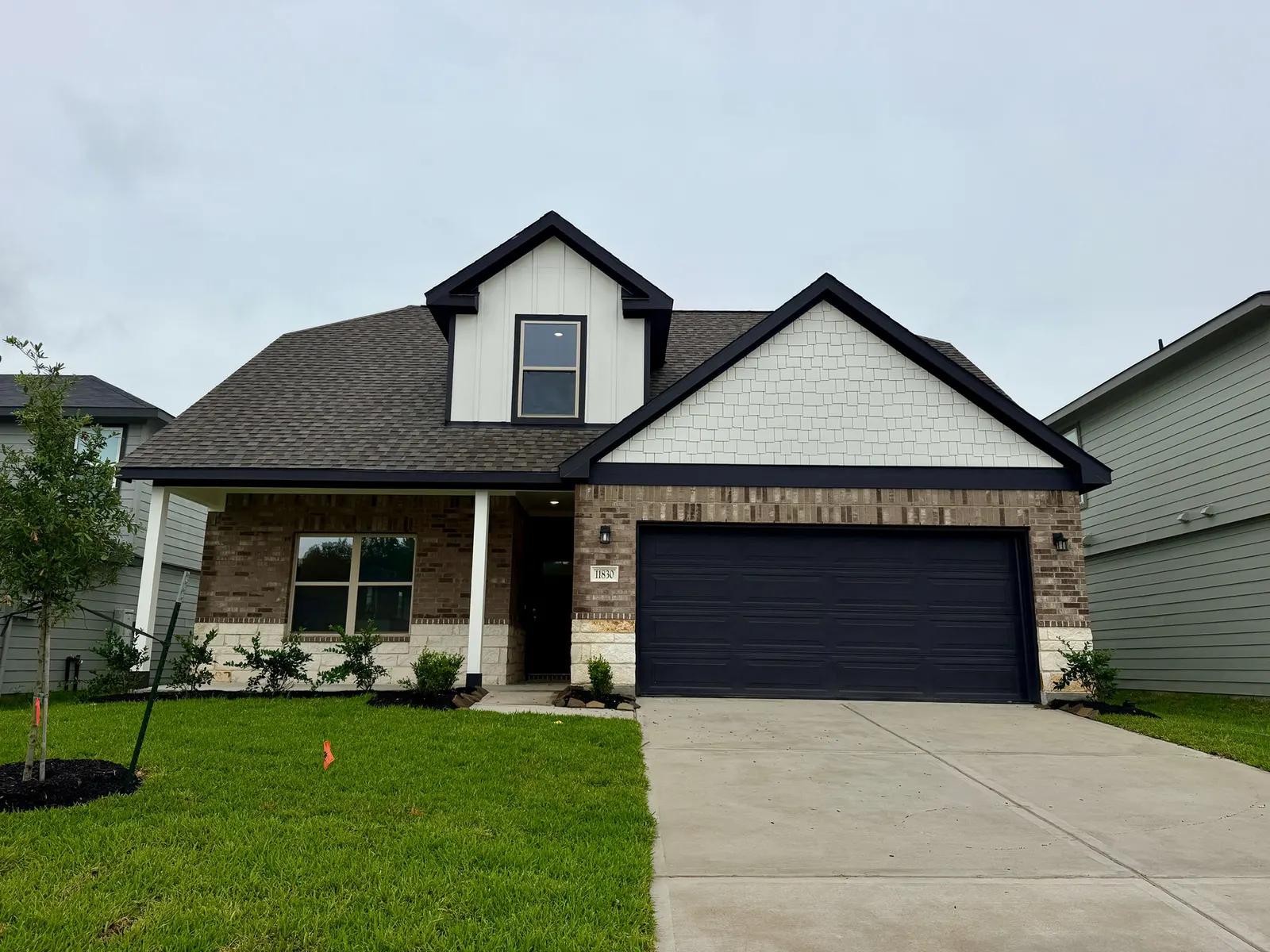 Front exterior of 11830 Serena's Song Drive, a new home by Alta Homes, Willis, TX