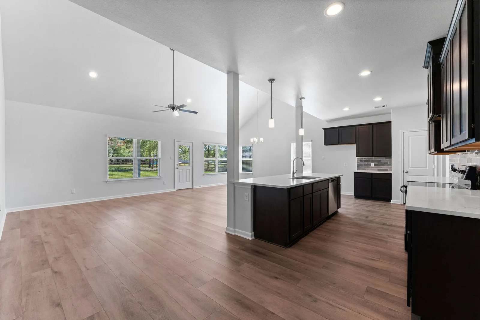 open floor plan with vaulted ceiling