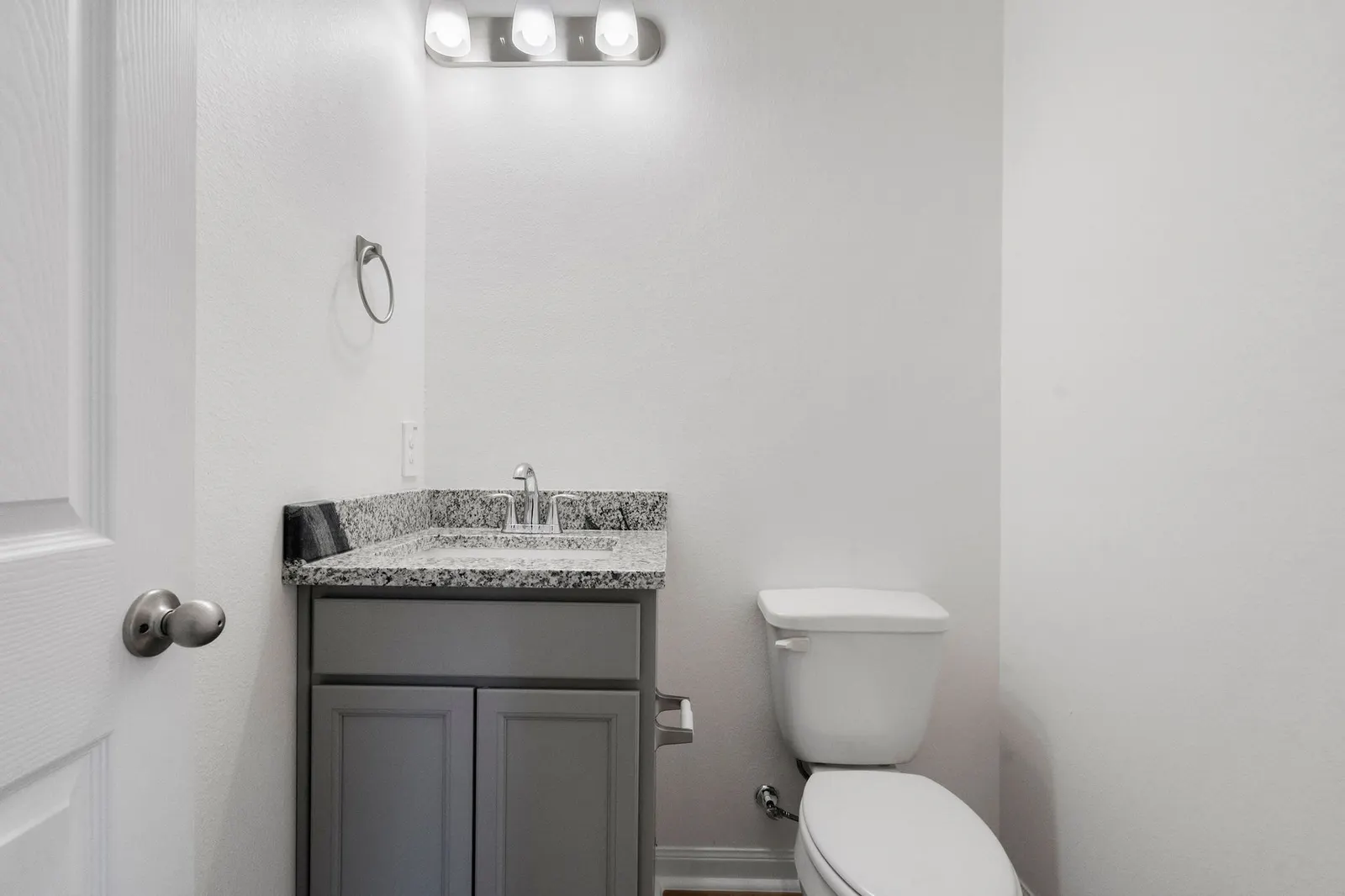 Powder bathroom with vanity at Cedar Crossing by Alta Homes