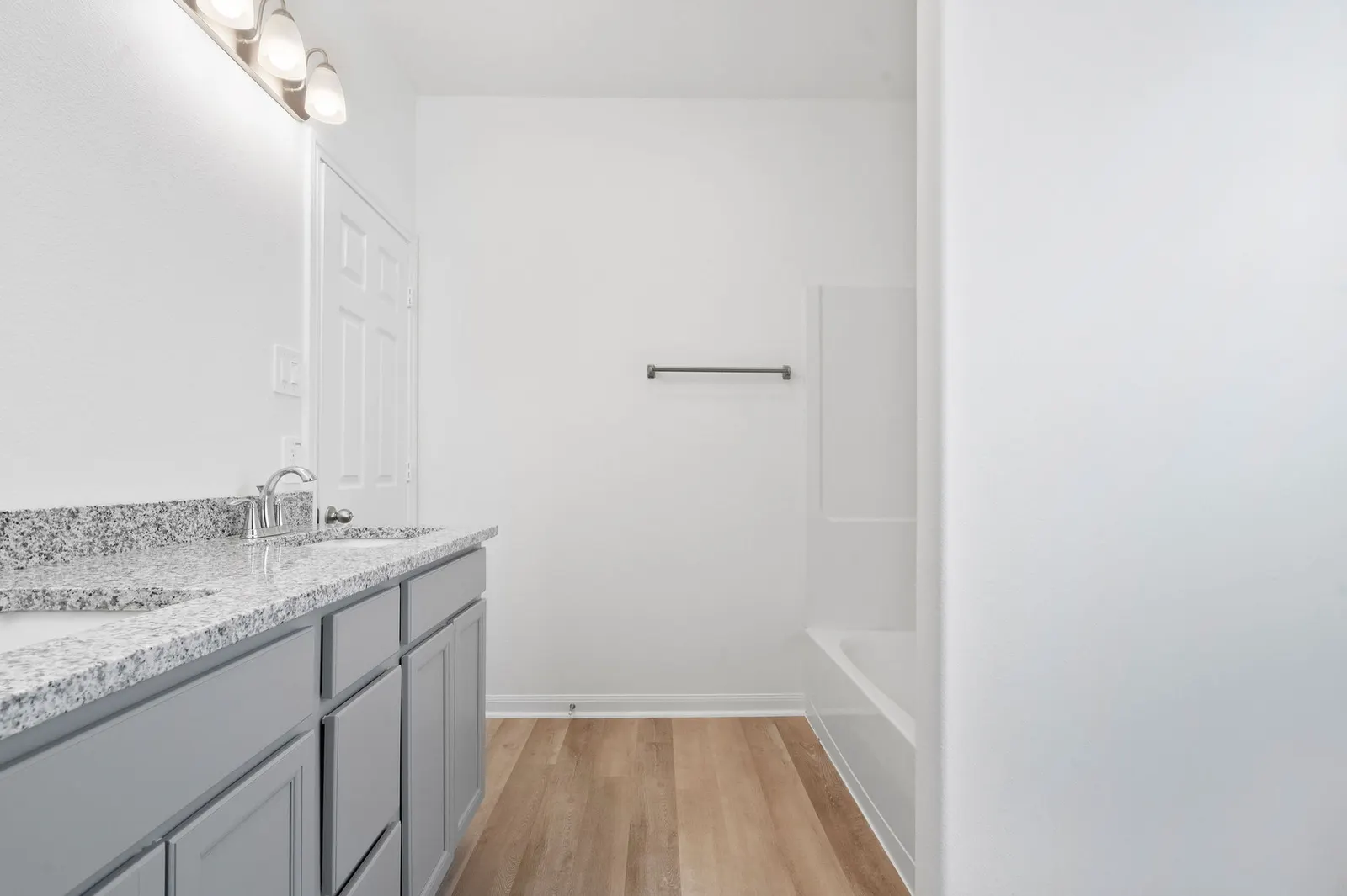 Bathroom vanity beside the shower at Cedar Crossing by Alta Homes