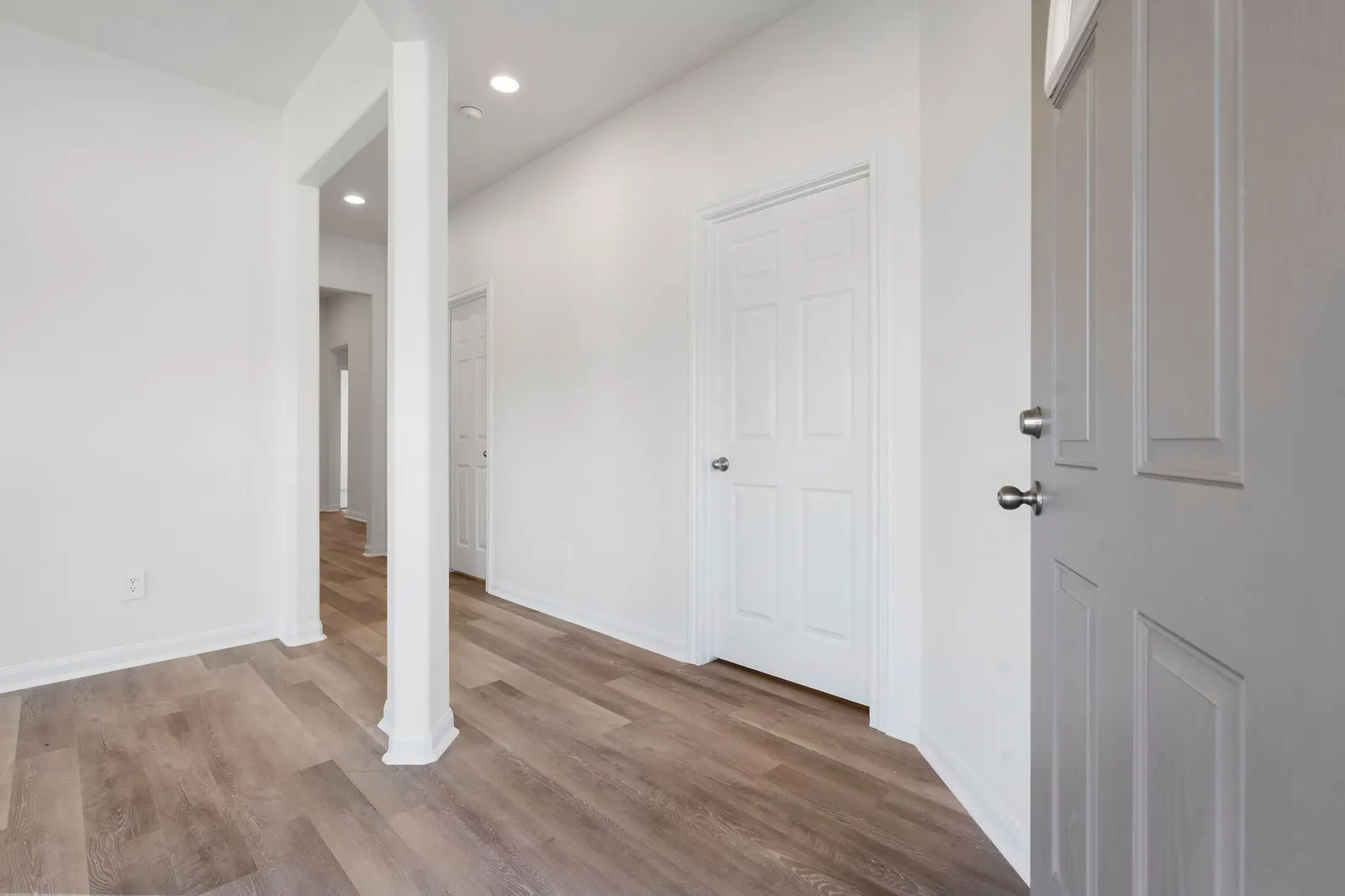 Entry hallway with column detail at Cedar Crossing by Alta Homes